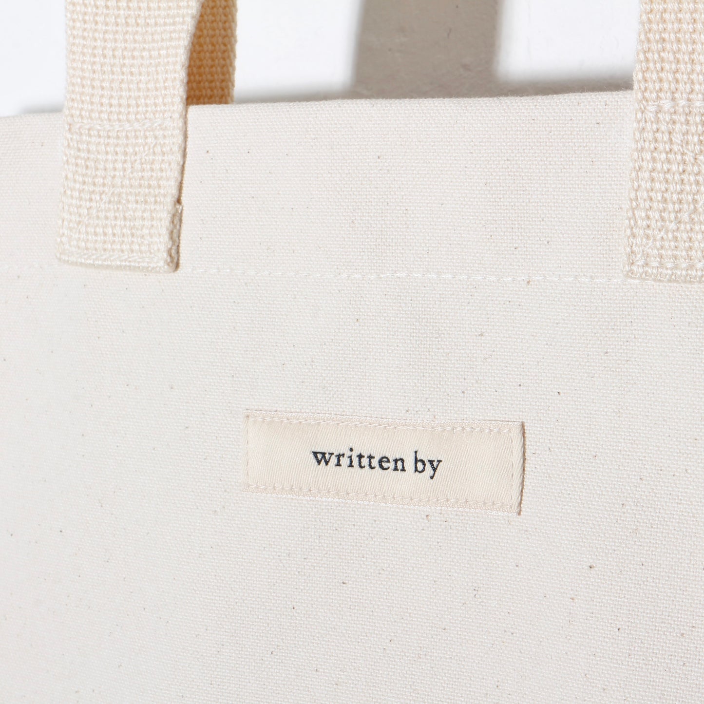 written by /TOTE BAG flat