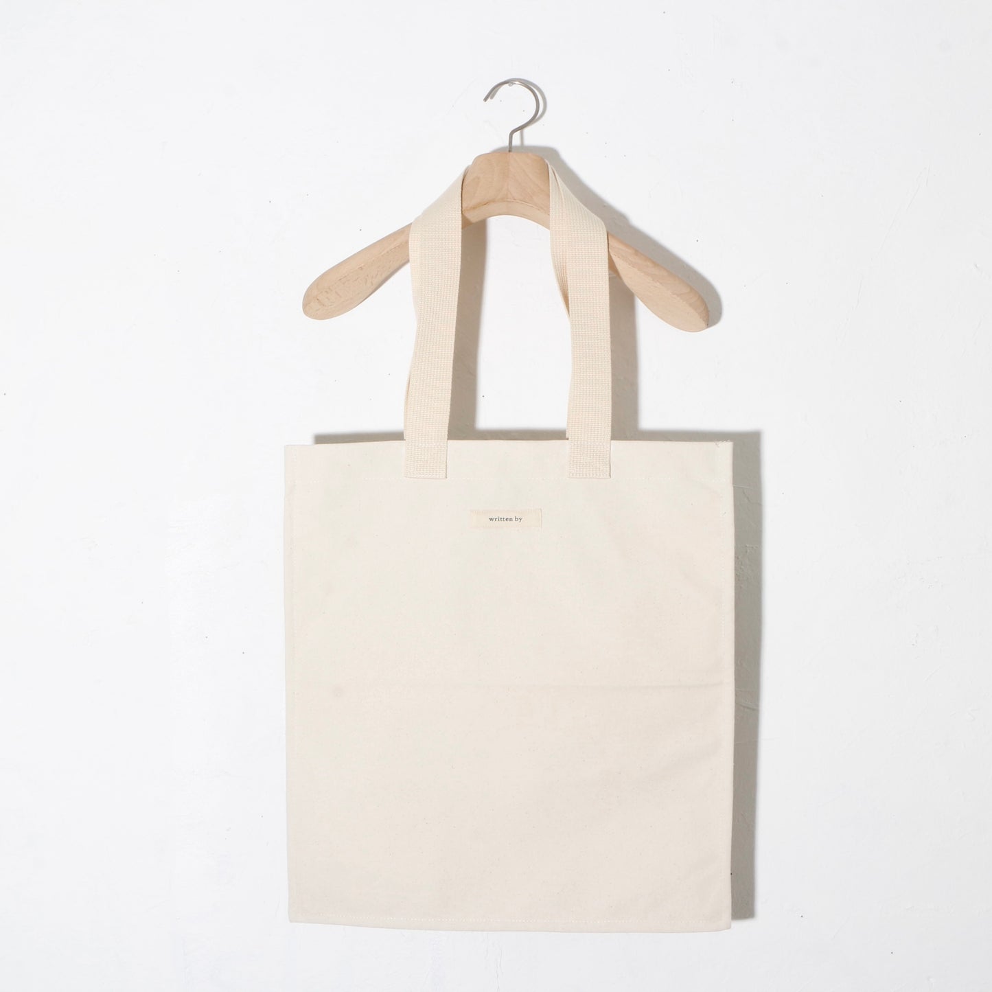 written by /TOTE BAG flat