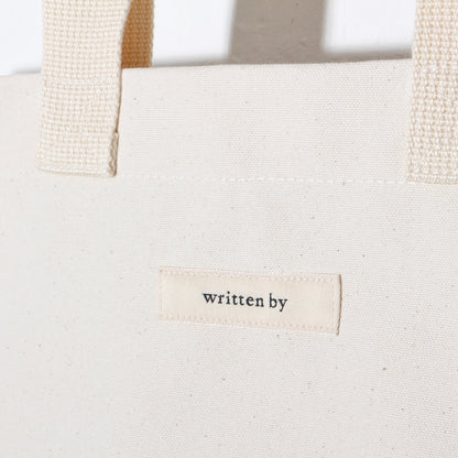 written by /TOTE BAG flat