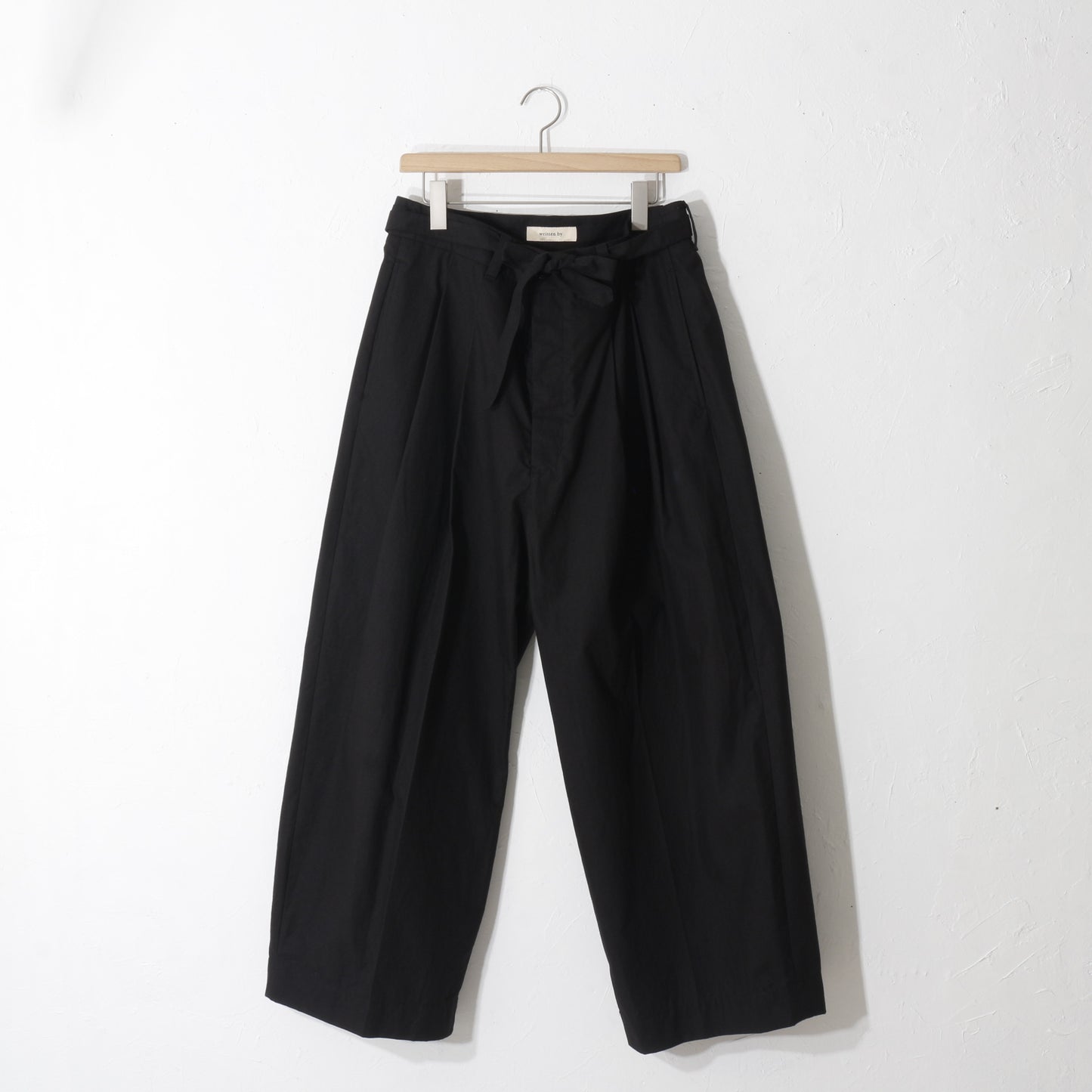 written by / slacks pants /bk