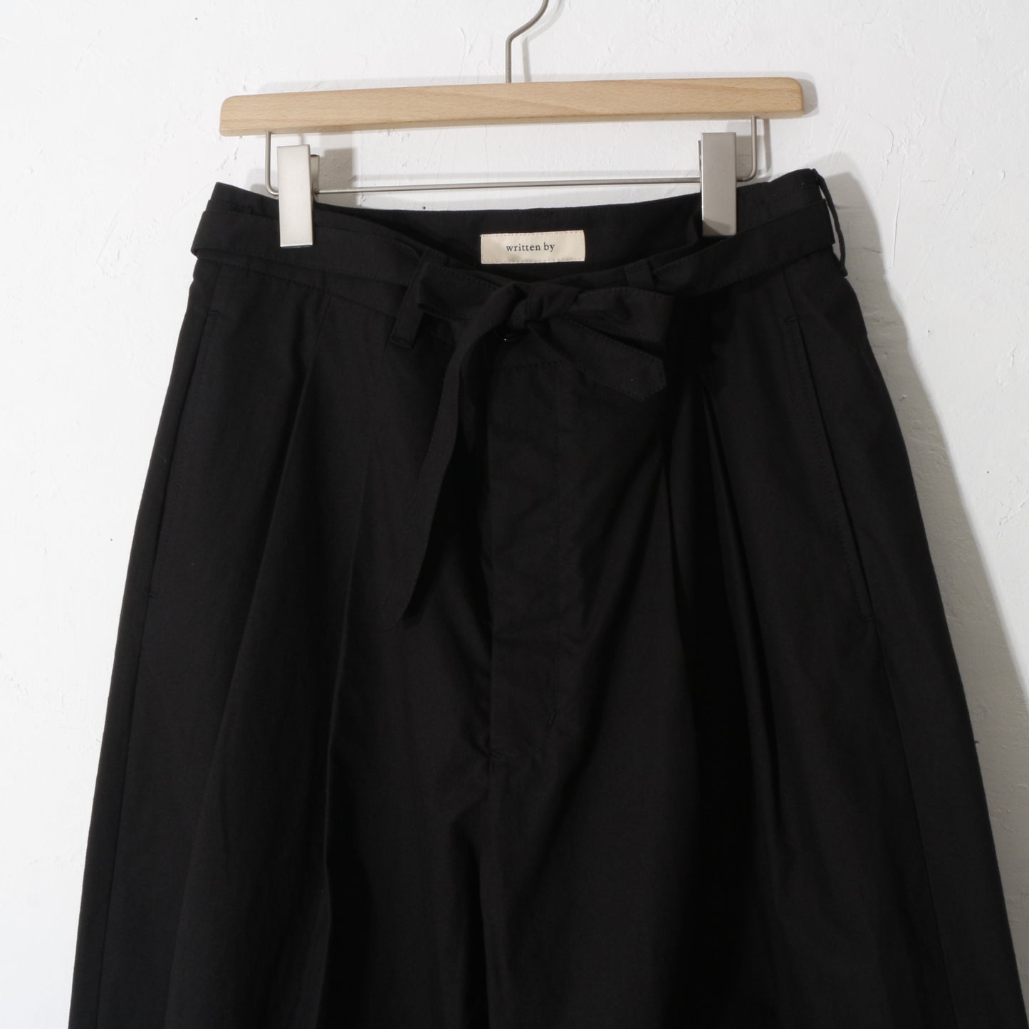 written by / slacks pants /bk
