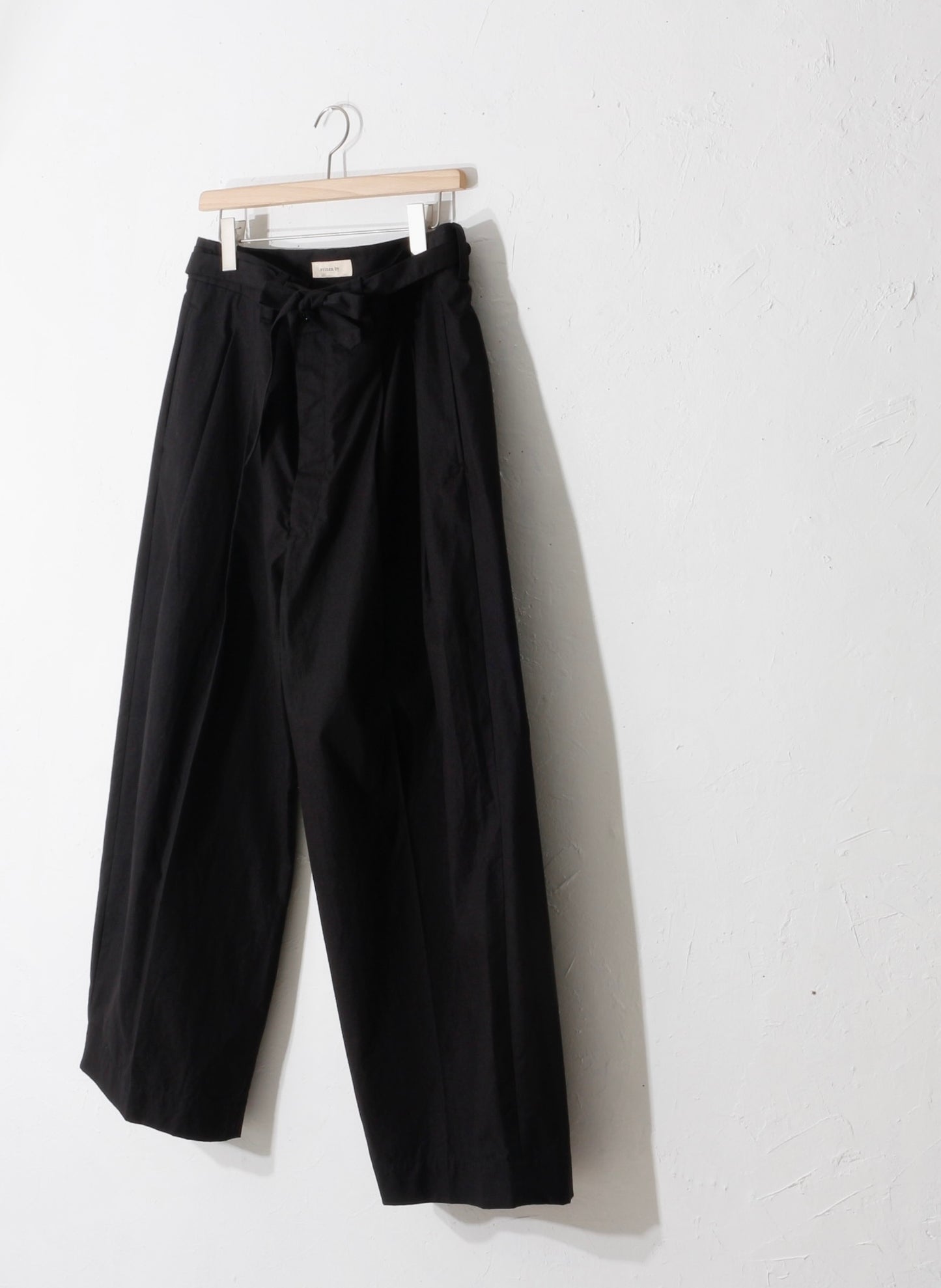 written by / slacks pants /bk